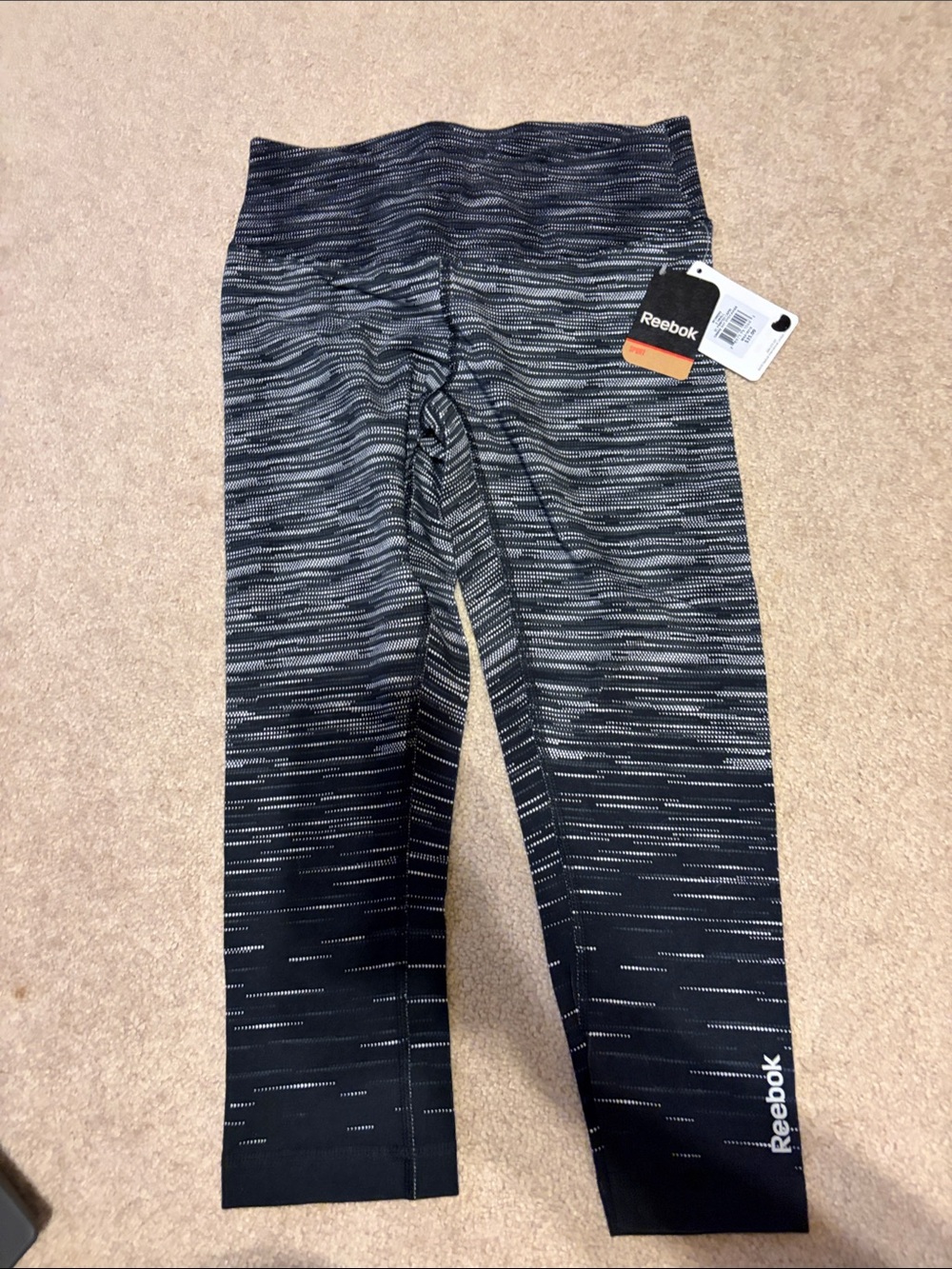 Reebok women’s Black and Heathered Gray Performance capri Leggings